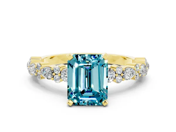 Emerald Cut Blue Topaz Side Stone Solitaire Ring with Round and Four-Prong Setting Yellow gold