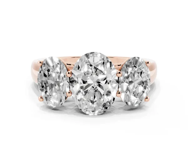 Oval Cut Three-Stone Diamond Ring with Prong Setting on a Classic Band Rose gold