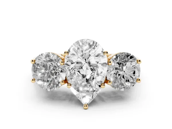 Three-Stone Pear Cut Diamond Engagement Ring with Prong Setting on a Classic Band Yellow gold