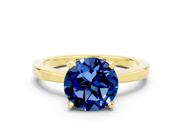 Round Cut Blue Sapphire Solitaire Engagement Ring with Classic Band and Four-Prong Setting Yellow gold