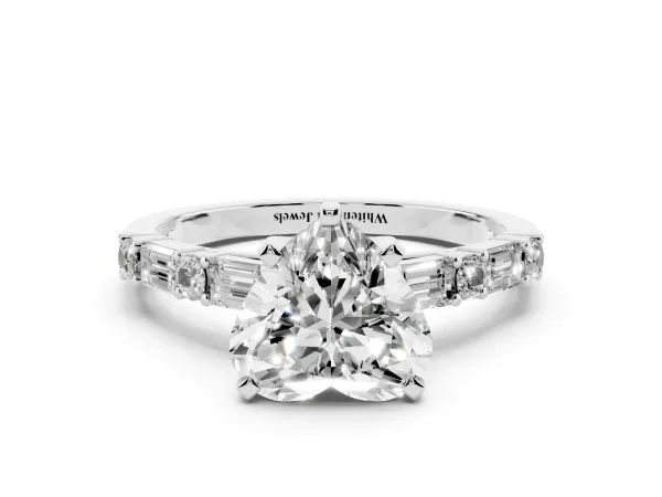 Heart Cut Diamond Solitaire with Side Baguettes and Channel Set Band Platinum