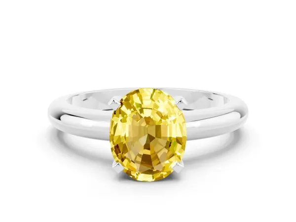 Oval Cut Yellow Sapphire Solitaire Engagement Ring with Round Band and Four-Prong Setting Silver