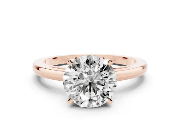 Round Cut Solitaire Diamond Engagement Ring with Four-Prong Setting on a Classic Band Rose gold