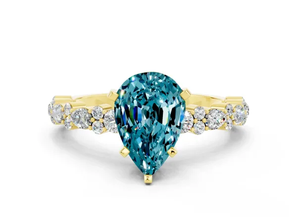 Pear Cut Blue Topaz Side Stone Solitaire Ring with Round and Four-Prong Setting Yellow gold