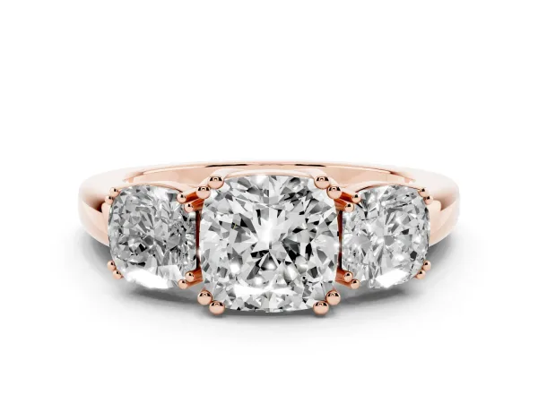 Three-Stone Cushion Cut Cut Diamond Ring with Channel Set Band and Four-Prong Setting Rose gold