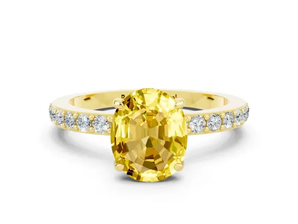 Oval Cut Yellow Sapphire Solitaire Engagement Ring with Pavé Band and Four-Prong Setting Yellow gold