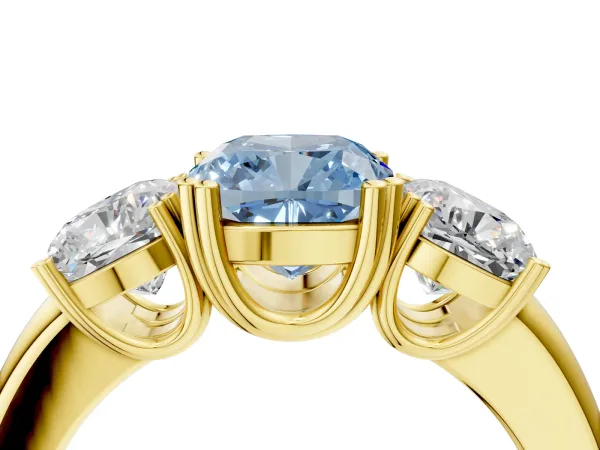 Fancy Blue Three-Stone Cushion Cut Cut Diamond Ring with Channel Set Band and Four-Prong Setting Yellow gold