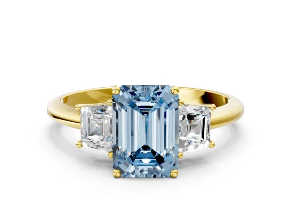 Fancy Blue Emerald Cut Diamond Three-Stone Ring with Trapezoid Side Stones and Prong Setting Yellow gold