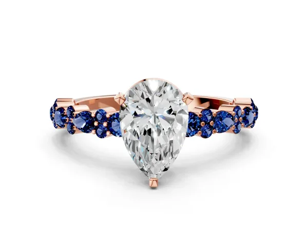 Pear Cut Diamond Side Stone Solitaire Ring with Round Blue Sapphire and Four-Prong Setting Rose gold