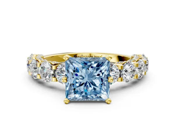 Fancy Blue Princess Cut Diamond Side Stone Engagement Ring with Four-Prong Setting Yellow gold