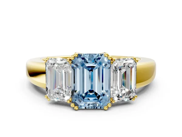 Fancy Blue Three-Stone Emerald Cut Cut Diamond Ring with Channel Set Band and Four-Prong Setting Yellow gold