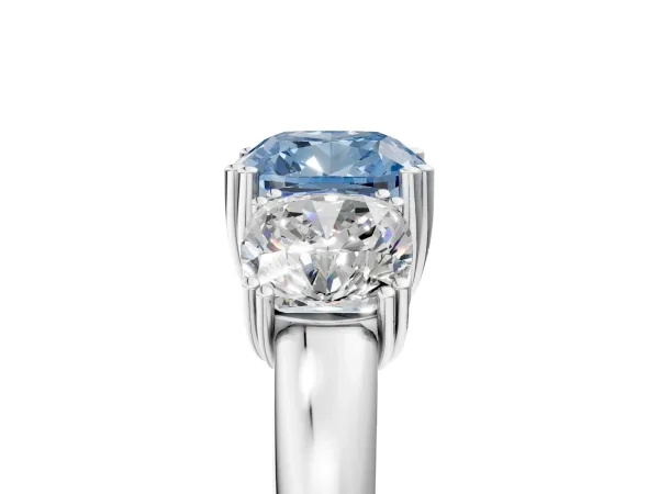 Fancy Blue Three-Stone Cushion Cut Cut Diamond Ring with Channel Set Band and Four-Prong Setting Platinum