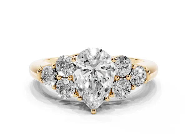 Pear Cut Cut Diamond Cluster Ring with Round Accent Stones and Prong Setting on a Classic Band Yellow gold