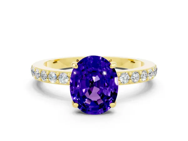Oval Cut Tanzanite Solitaire Engagement Ring with Pavé Band and Four-Prong Setting Yellow gold