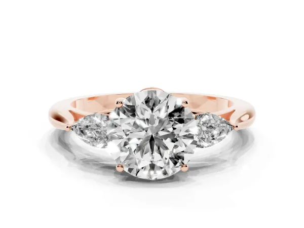 Three-Stone Round Cut Diamond Ring with Pear Side Stones in Four-Prong Setting Rose gold