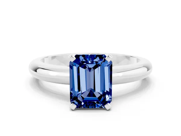 Emerald Cut Blue Sapphire Solitaire Engagement Ring with Round Band and Four-Prong Setting Silver