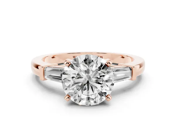 Round Cut Cut Diamond Solitaire Ring with Tapered Baguette Accents and Four-Prong Setting Rose gold