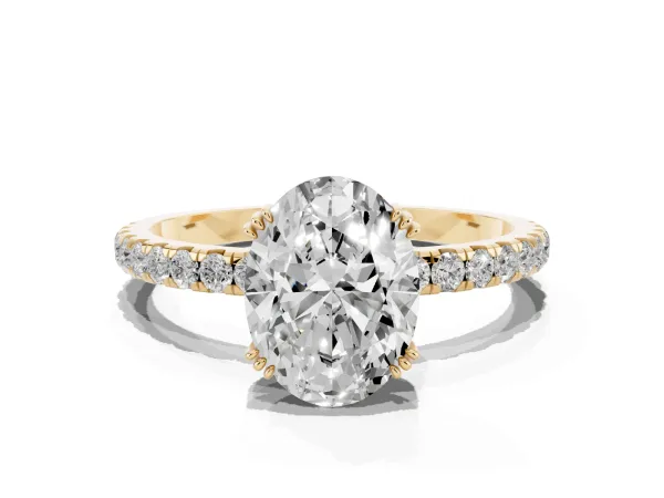 Oval Cut Brilliant Solitaire with Pavé Band and Claw Prong Setting Yellow gold
