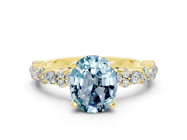 Oval Cut Aquamarine Side Stone Solitaire Ring with Round and Four-Prong Setting Yellow gold
