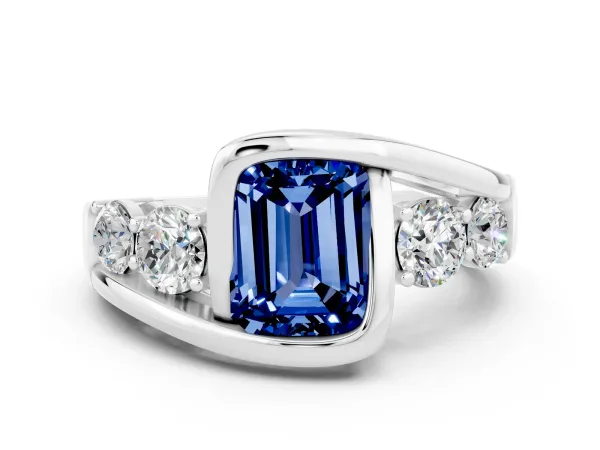 Bezel Set Emerald Cut Blue Sapphire Bypass Ring with Round Accents Platinum