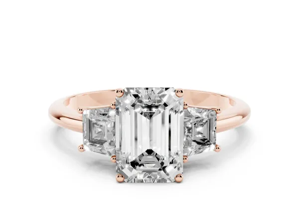 Emerald Cut Diamond Three-Stone Ring with Trapezoid Side Stones and Prong Setting Rose gold