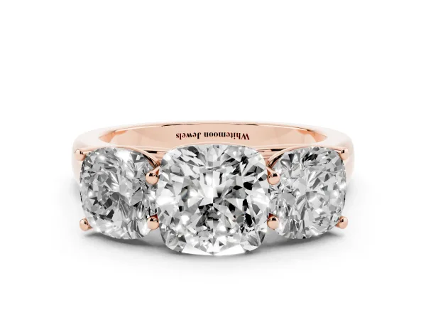 Cushion Cut Three-Stone Diamond Ring with Prong Setting on a Classic Band Rose gold