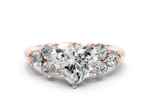 Heart Cut Cut Diamond Cluster Ring with Round Accent Stones and Prong Setting on a Classic Band Rose gold