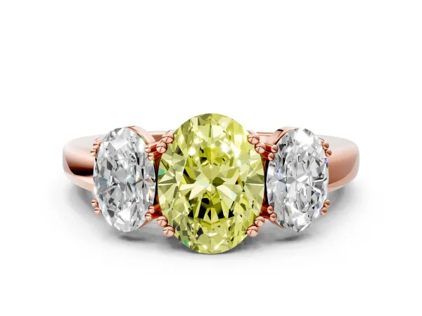 Fancy Yellow Three-Stone Oval Cut Cut Diamond Ring with Channel Set Band and Four-Prong Setting Rose gold