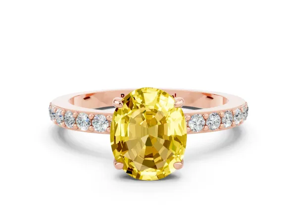 Oval Cut Yellow Sapphire Solitaire Engagement Ring with Pavé Band and Four-Prong Setting Rose gold