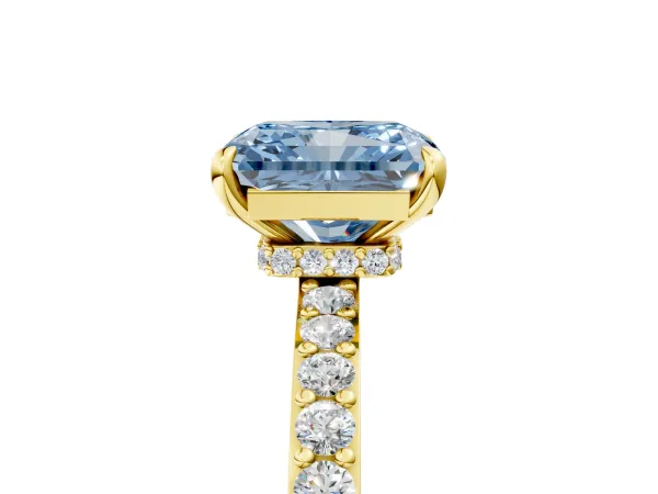 Fancy Blue Radiant Cut Diamond Solitaire Engagement Ring with Pavé Band and Four-Prong Setting Yellow gold