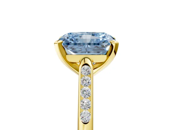 Fancy Blue Radiant Cut Diamond Solitaire Ring with Channel Set Round Band and Prong Setting Yellow gold