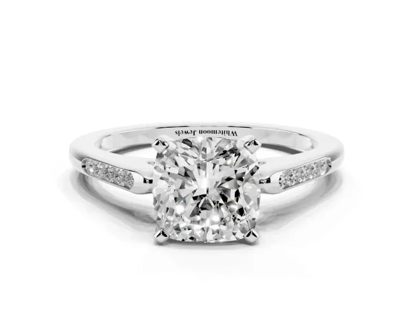 Cushion Cut Diamond Solitaire Ring with Channel Set Round Band and Prong Setting Platinum