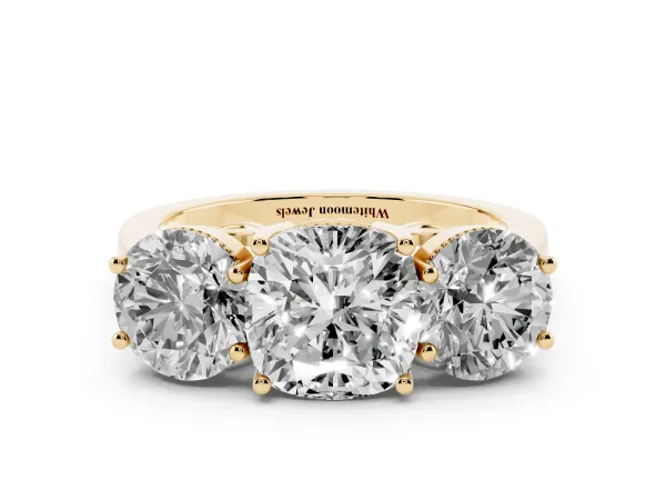 Three-Stone Cushion Cut Diamond Engagement Ring with Prong Setting on a Classic Band Yellow gold
