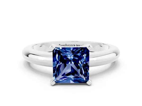 Princess Cut Blue Sapphire Solitaire Engagement Ring with Round Band and Four-Prong Setting Silver