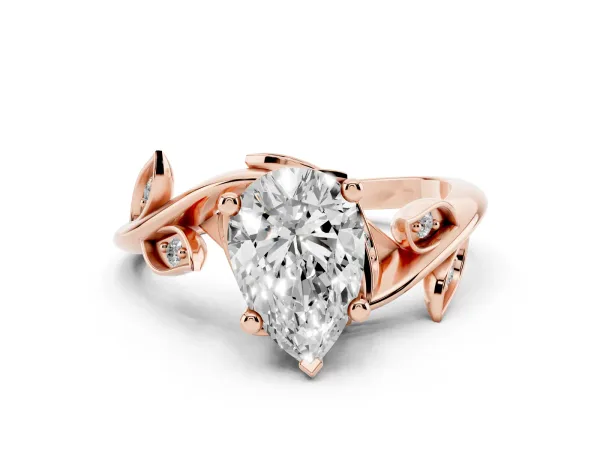Pear Cut Solitaire Twist Engagement Ring with Leaf Accents and Prong Setting Rose gold