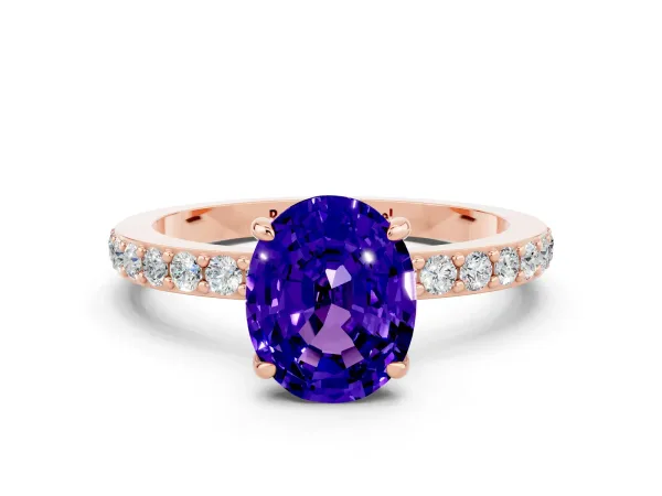 Oval Cut Tanzanite Solitaire Engagement Ring with Pavé Band and Four-Prong Setting Rose gold