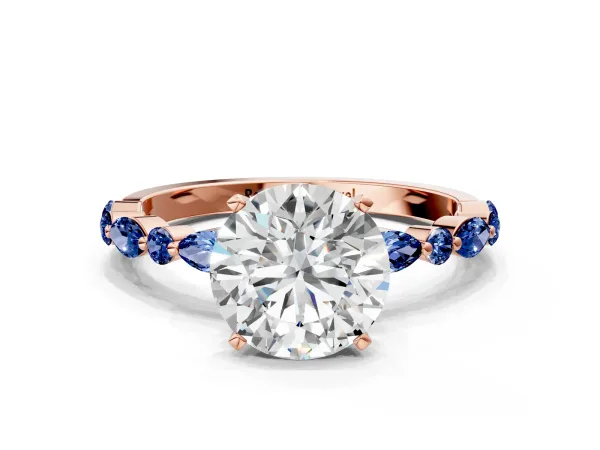 Round Cut Diamond Ring with Marquise and Round Blue Sapphire Side Stones and Four-Prong Setting Rose gold