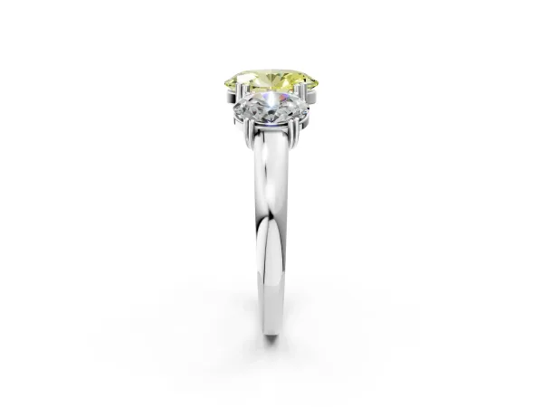 Fancy Yellow Three-Stone Oval Cut Cut Diamond Ring with Channel Set Band and Four-Prong Setting Platinum