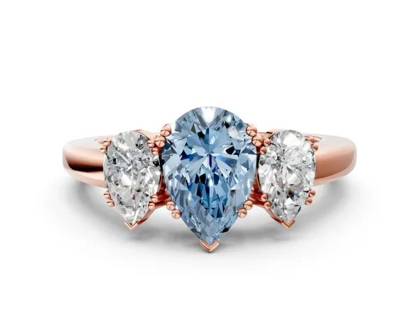 Fancy Blue Three-Stone Pear Cut Cut Diamond Ring with Channel Set Band and Four-Prong Setting Rose gold