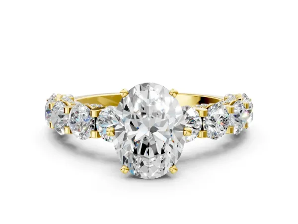 Oval Cut Diamond Side Stone Engagement Ring with Four-Prong Setting Yellow gold