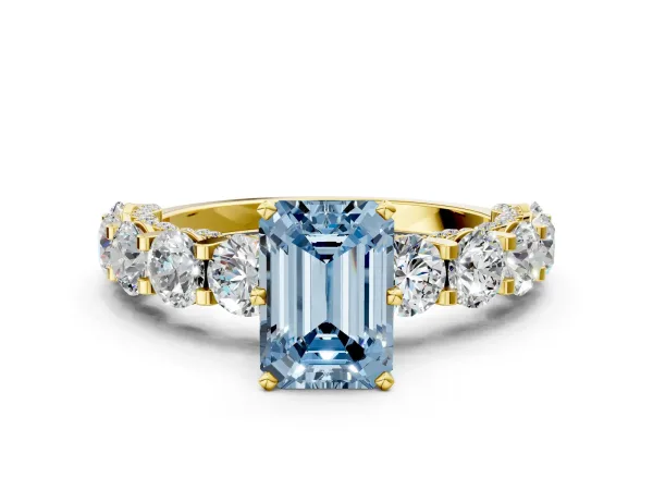 Fancy Blue Emerald Cut Diamond Side Stone Engagement Ring with Four-Prong Setting Yellow gold