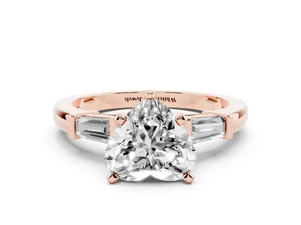 Heart Cut Cut Diamond Solitaire Ring with Tapered Baguette Accents and Four-Prong Setting Rose gold