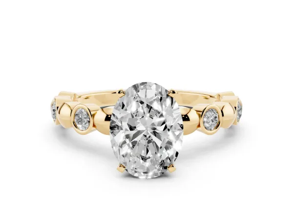 Oval Cut Solitaire Bezel-Set Diamond Ring with Beaded Band and Four-Prong Setting Yellow gold
