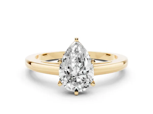 Pear Cut Solitaire Diamond Engagement Ring with Four-Prong Setting on a Classic Band Yellow gold