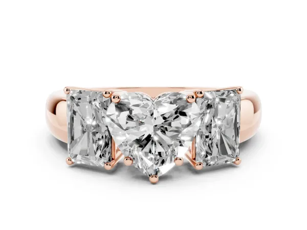 Three-Stone Heart Cut Diamond Ring with Emerald Side Stones and Prong Setting Rose gold