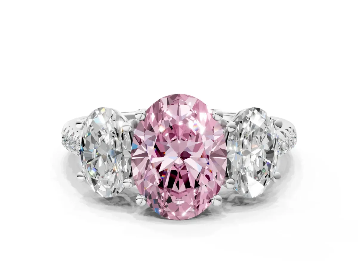 Fancy Pink Three-Stone Oval Cut Diamond Ring with Round Pavé Band and Prong Setting Silver