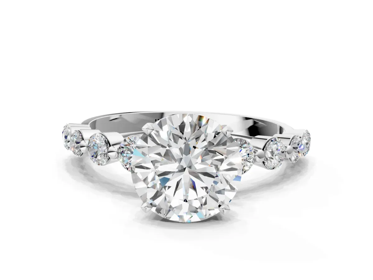 Round Cut Solitaire Diamond Ring with Pave Band and Four-Prong Setting Silver