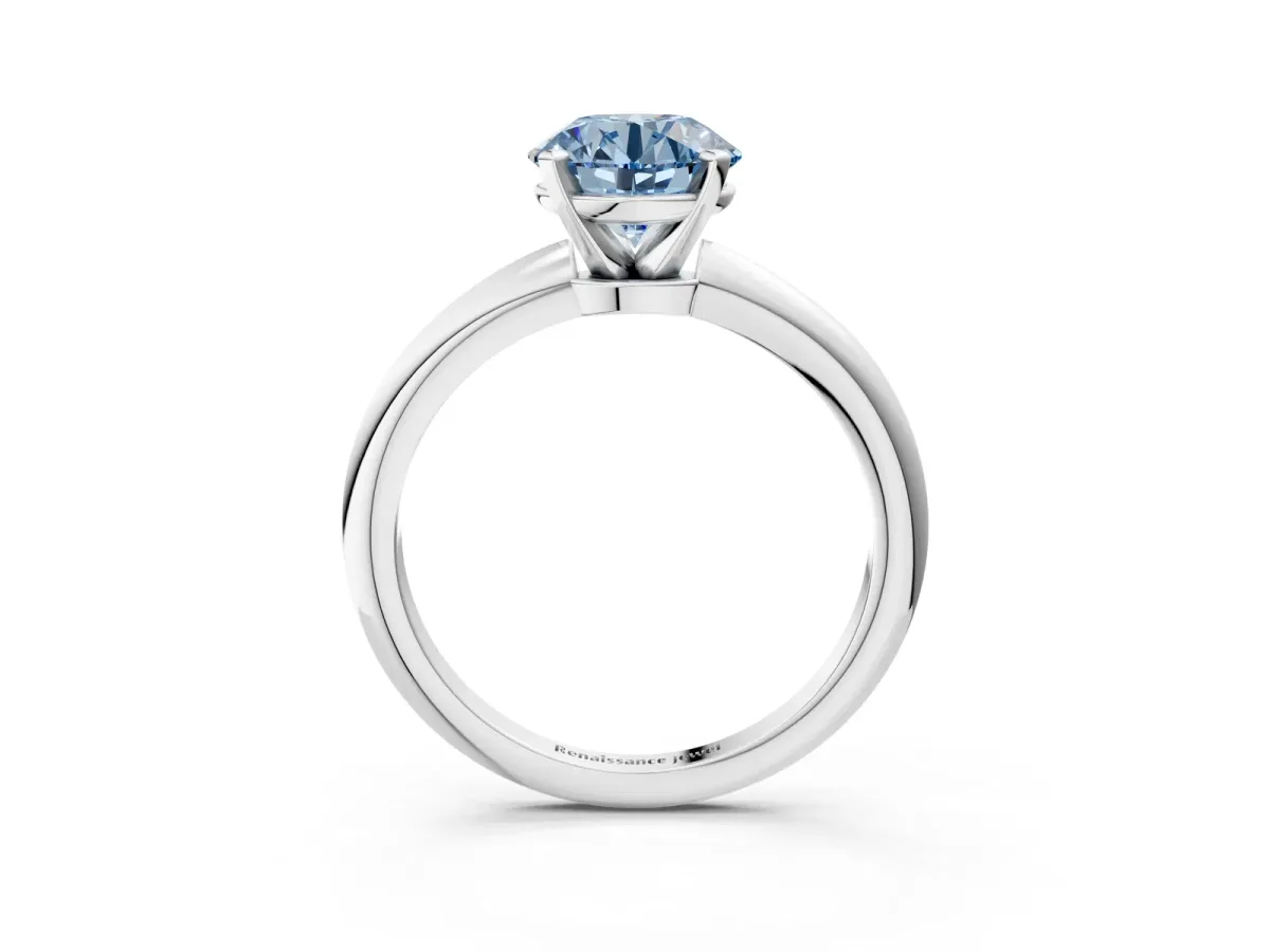 Fancy Blue Round Cut Diamond Solitaire Ring with Six-Prong Setting and Classic Band Silver
