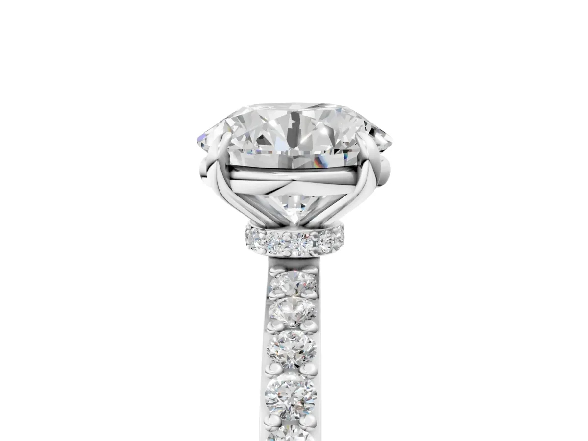 Round Cut Diamond Solitaire Engagement Ring with Pavé Band and Four-Prong Setting Silver