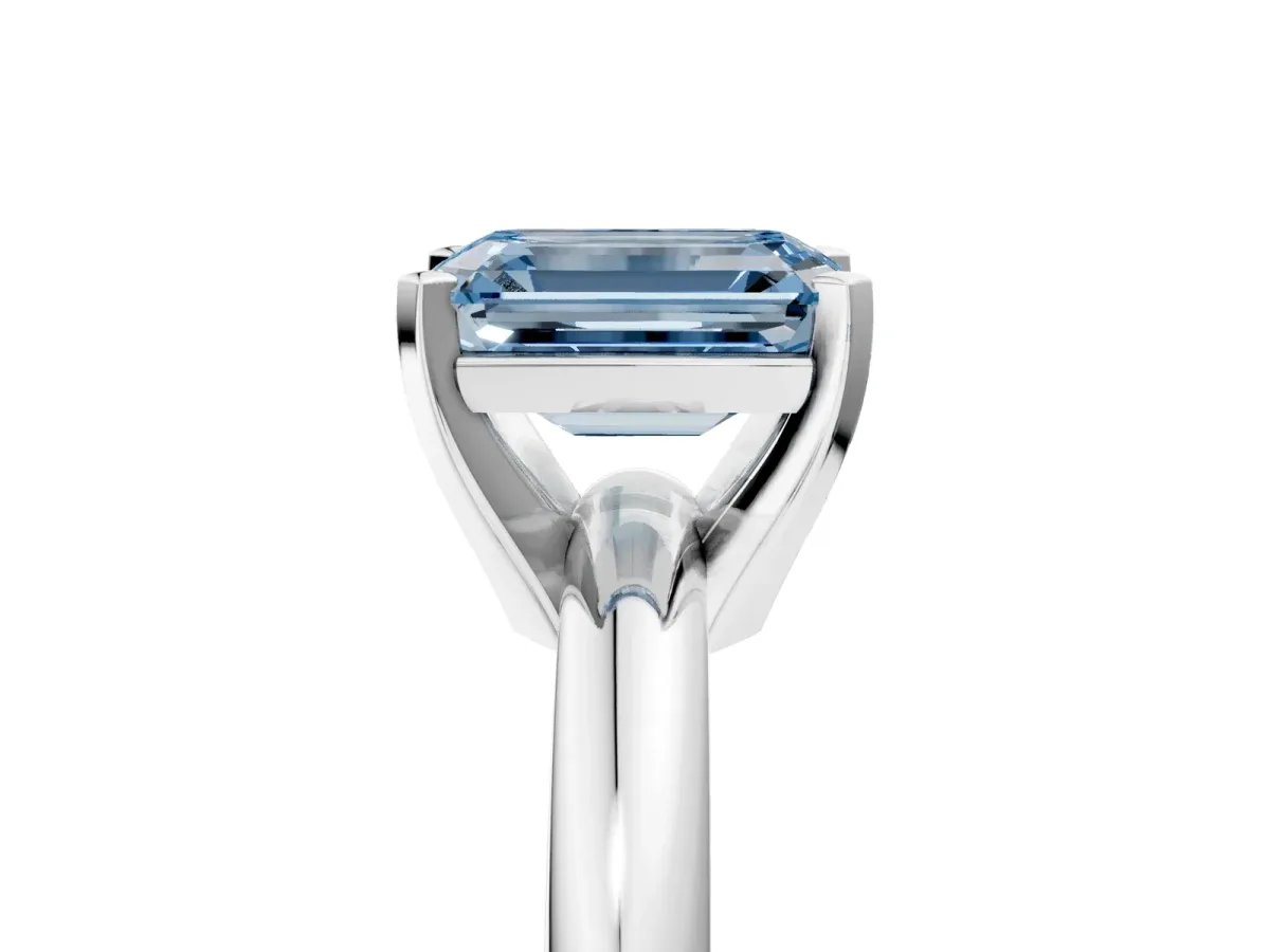 Fancy Blue Emerald Cut Diamond Solitaire Engagement Ring with Round Band and Four-Prong Setting Silver